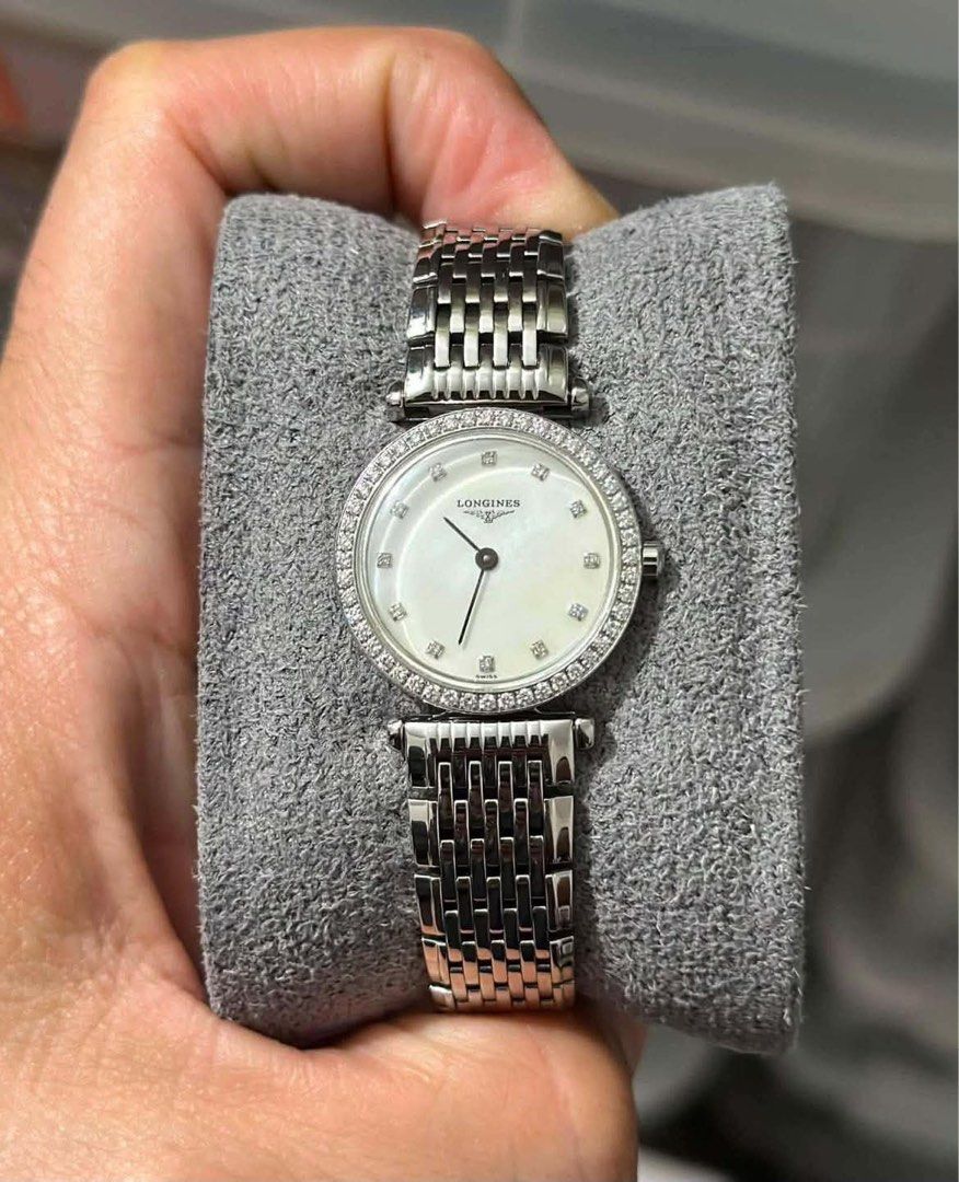 Longines La Grande Classique Diamond Bezel Watch (Category: Luxury Watches) located in Manila. Submitted by mattmnghy90104 (Listing ID 1457387595, Image 3). Description: Fs: Pre Owned Longines Diamonds Mother Of Pearl La Grande Classique Ladies Ref. #L4.241.0.80.6 24mm size Small Size Ladies Bezel Diamonds(authentic diamonds) Quartz Swiss Made Sapphire crystal Stainless Steel 9/10 Mint Condition Inclusions: Box and Unit only Market Price: 188k ! 