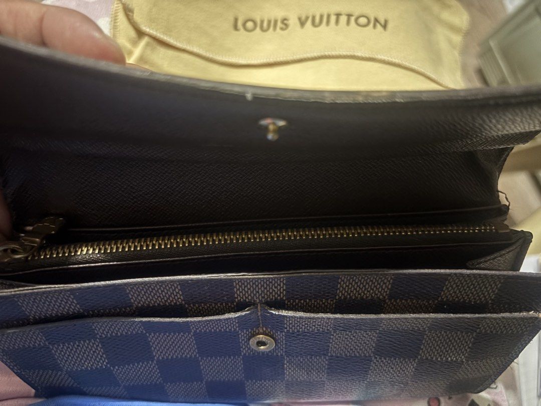 Louis Vuitton Damier Ebene Canvas Long Wallet (Category: Luxury Bags & Wallets) located in Marikina City. Submitted by alloriginalbyshed (Listing ID 1457354425, Image 2). Description: - Authentic Louis Vuitton wallet - Damier Ebene canvas - Secure snap button closure (issue) - Ample card slots and compartments - Zippered coin pocket - Includes dust bag - Perfect for organizing your essentials.