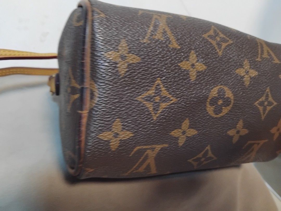 Louis Vuitton Monogram Speedy Nano Bag (Category: Luxury Bags & Wallets) located in Manila. Submitted by rosselegance (Listing ID 1457414857, Image 3). Description: - Authentic Louis Vuitton Speedy Nano bag - Classic monogram canvas with leather trim - Compact size, ideal for essentials - Versatile: carry by hand or with shoulder strap - Gold hardware - Shows some signs of wear on the leather.