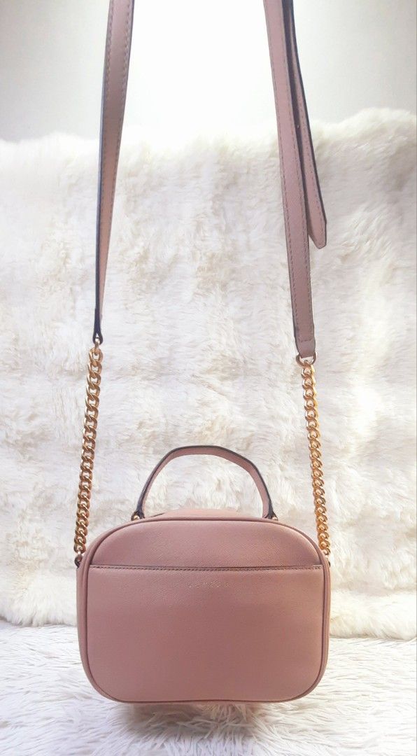 LOVCAT Pink Leather Chain Strap Top Handle Camera Bag (Category: Luxury Bags & Wallets) located in Mandaluyong City. Submitted by styleluxeonlineshop (Listing ID 1457466970, Image 1). Description: - Cute pink LOVCAT bag - Features a top handle - Includes a detachable gold chain strap - Interior zippered pocket and slip pockets - Versatile for everyday or evening use - Clean inside and out - Ready for a new owner.