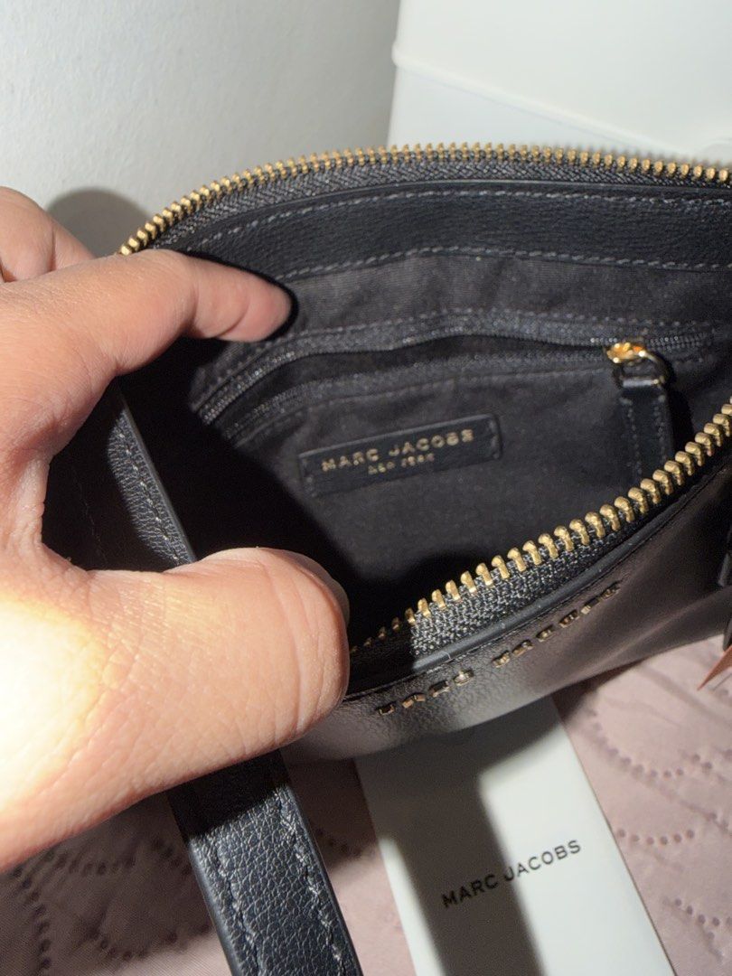 Marc Jacobs Black Leather Crossbody Bag (Category: Luxury Bags & Wallets) located in Manila. Submitted by frescyann14 (Listing ID 1457476659, Image 3). Description: - Authentic Marc Jacobs black leather crossbody bag - Elegant gold hardware details - Convenient exterior pocket - Secure zippered main compartment - Interior pocket for essentials - Comes with care card.