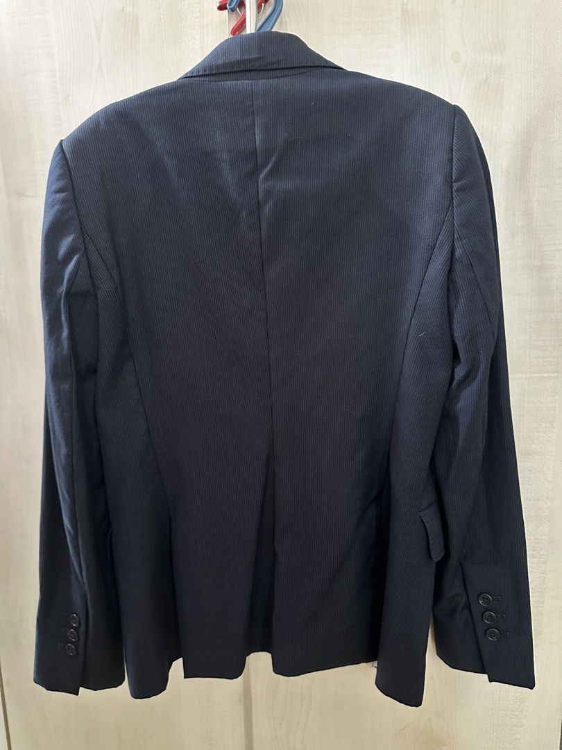 Massimo Dutti Navy Pinstripe Blazer with Paisley Lining (Category: Coats, Jackets and Outerwear) located in Manila. Submitted by gcgarcia (Listing ID 1457404141, Image 2). Description: - Classic navy blazer from Massimo Dutti - Features subtle pinstripes - Cool paisley print lining - Two-button closure - Versatile for work or evening wear - A stylish wardrobe essential - Fits small to medium - with undone stitches in the inner cloth.