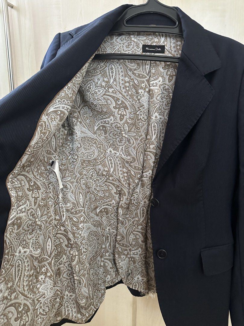 Massimo Dutti Navy Pinstripe Blazer with Paisley Lining (Category: Coats, Jackets and Outerwear) located in Manila. Submitted by gcgarcia (Listing ID 1457404141, Image 3). Description: - Classic navy blazer from Massimo Dutti - Features subtle pinstripes - Cool paisley print lining - Two-button closure - Versatile for work or evening wear - A stylish wardrobe essential - Fits small to medium - with undone stitches in the inner cloth.