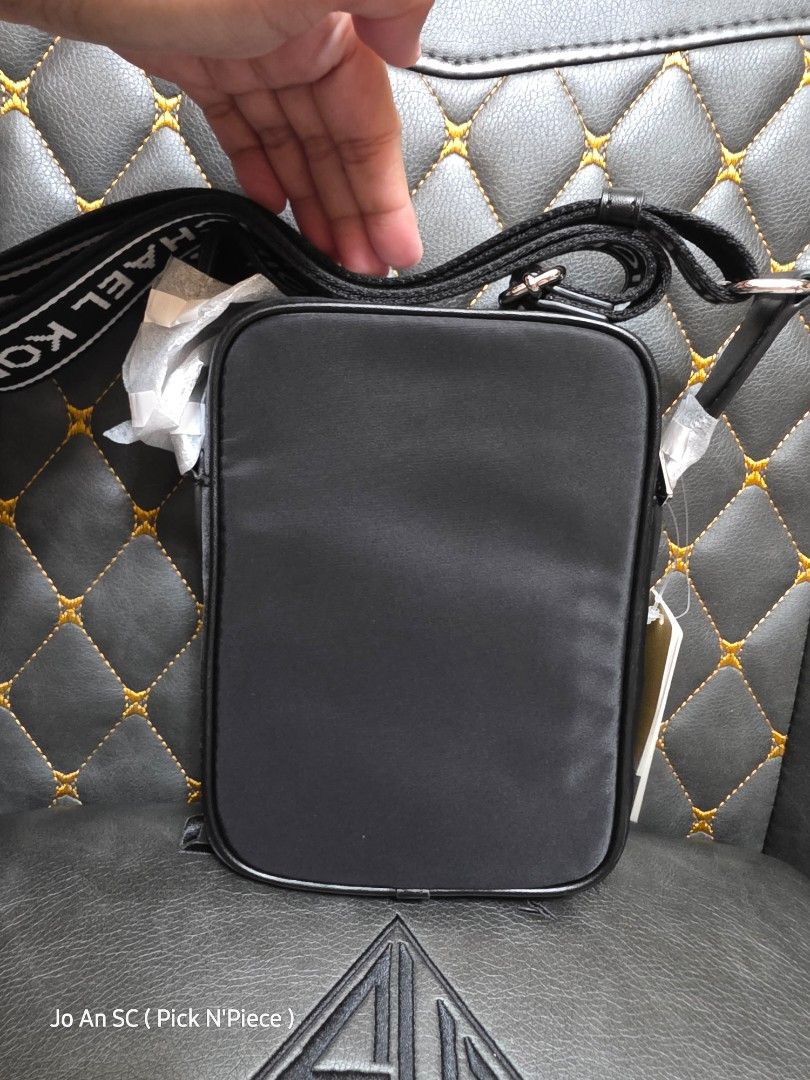 MICHAEL KORS KHAI BLACK XBODY BAG (Category: Cross-body Bags) located in Quezon City. Submitted by joansc (Listing ID 1457500689, Image 2). Description: SOURCED: US 100% ORIGINAL ONLY W/TAG, POLYPLASTIC, CARE CARD.
