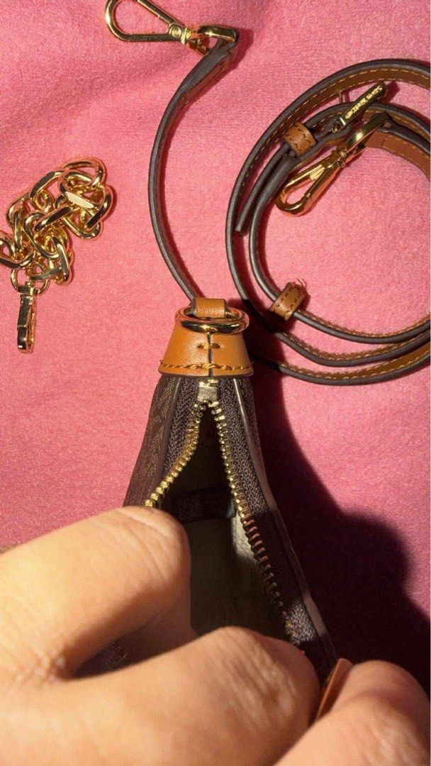Michael Kors Monogram Mini Bag with Straps (Category: Luxury Bags & Wallets) located in Quezon City. Submitted by calithilel (Listing ID 1457487520, Image 2). Description: ✨ Michael Kors Jet Set Charm Small Logo Pochette – Brown/Acorn ✨ Preloved and still in very good condition 🤎 Classic MK signature canvas with gold-tone hardware — perfect as a shoulder bag or crossbody. 💰 ₱4,500 negotiable Details/Inclusions: • Approx. 8” wide • Gold chain st