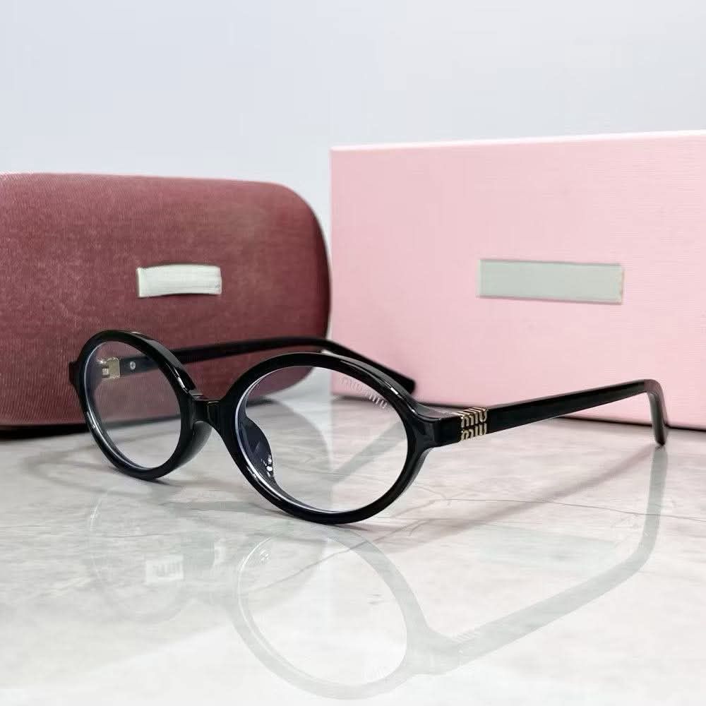 Miu Miu Oval Eyeglasses - Tortoiseshell & Black (Category: Sunglasses & Eyewear) located in Manila. Submitted by cleerview (Listing ID 1457497483, Image 2). Description: - Brand: Miu Miu - Style: Oval eyeglasses - Available Colors: Tortoiseshell (clear lenses), Black (tinted lenses) - Features: Miu Miu logo on temples - Includes: Pink case and pink box - Perfect for: Everyday wear or fashion statement.