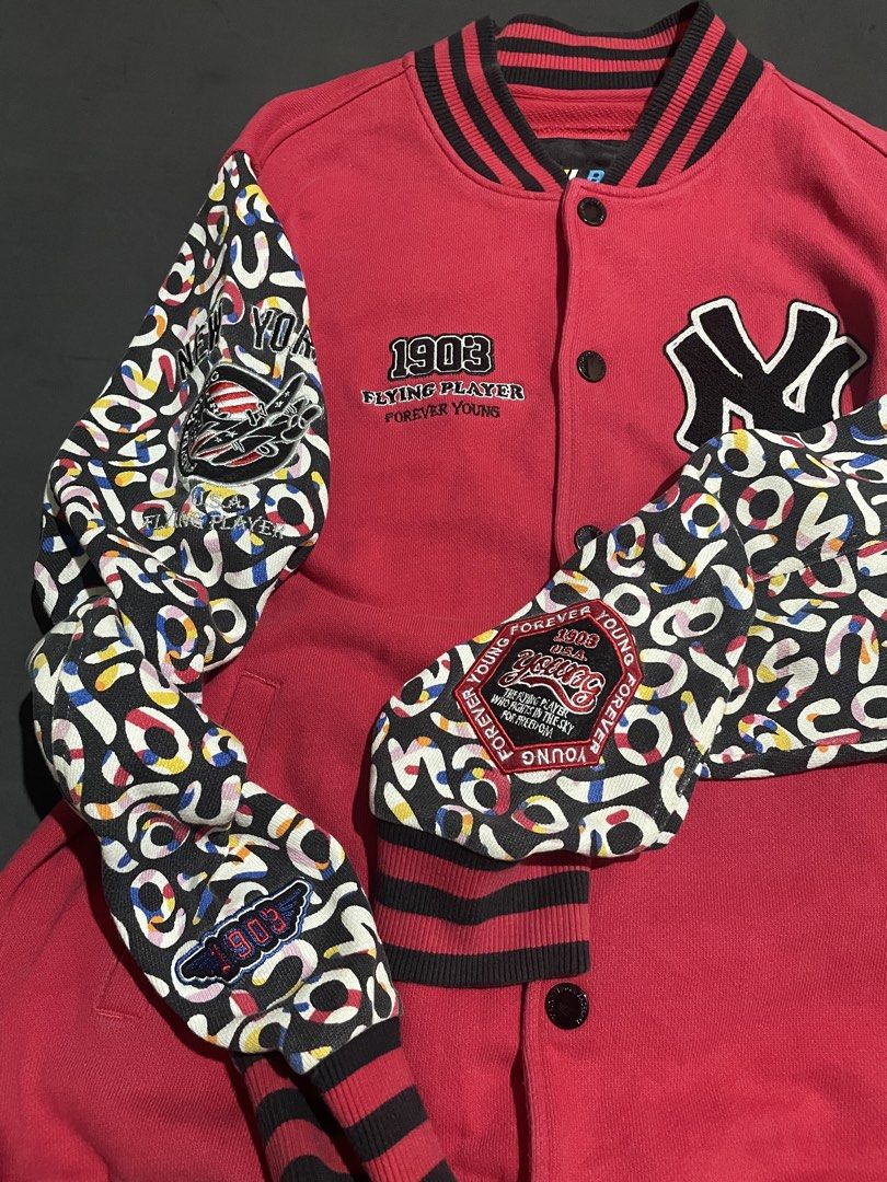 MLB New York Yankees Varsity Jacket Red M (Category: Coats, Jackets and Outerwear) located in Cebu City. Submitted by grand_kian (Listing ID 1457489308, Image 2). Description: - Red MLB varsity jacket - Features NY Yankees logo - Text: '1903 Flying Player Forever Young' - Unique patterned sleeves - Ribbed collar, cuffs, and hem - Button-up front - Size: Medium (M) - Condition: Minor marks on the front (please check photos for details).