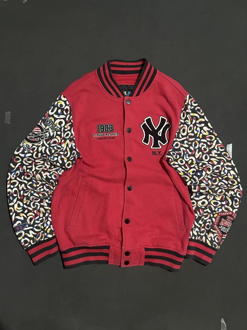 MLB New York Yankees Varsity Jacket Red M (Category: Coats, Jackets and Outerwear) located in Cebu City. Submitted by grand_kian (Listing ID 1457489308, Image 1). Description: - Red MLB varsity jacket - Features NY Yankees logo - Text: '1903 Flying Player Forever Young' - Unique patterned sleeves - Ribbed collar, cuffs, and hem - Button-up front - Size: Medium (M) - Condition: Minor marks on the front (please check photos for details).