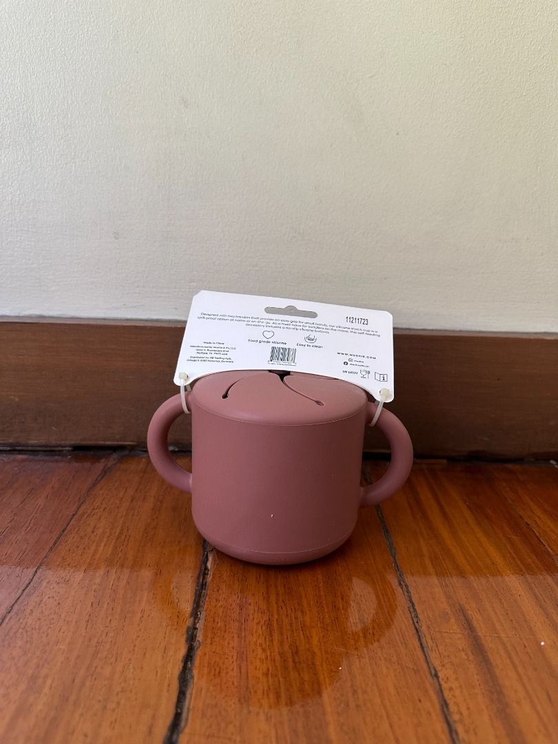 Mushie Silicone Snack Cup - Dusty Rose (Category: Weaning & Toddler Feeding) located in Makati City. Submitted by travelfinds34611 (Listing ID 1457363197, Image 3). Description: - Mushie Silicone Snack Cup in Dusty Rose - Features easy-grip handles for little hands - Lid has slits to prevent spills while allowing snack access - Ideal for babies learning to self-feed - Made from durable, easy-to-clean silicone - Perfect for snacks at home or on th