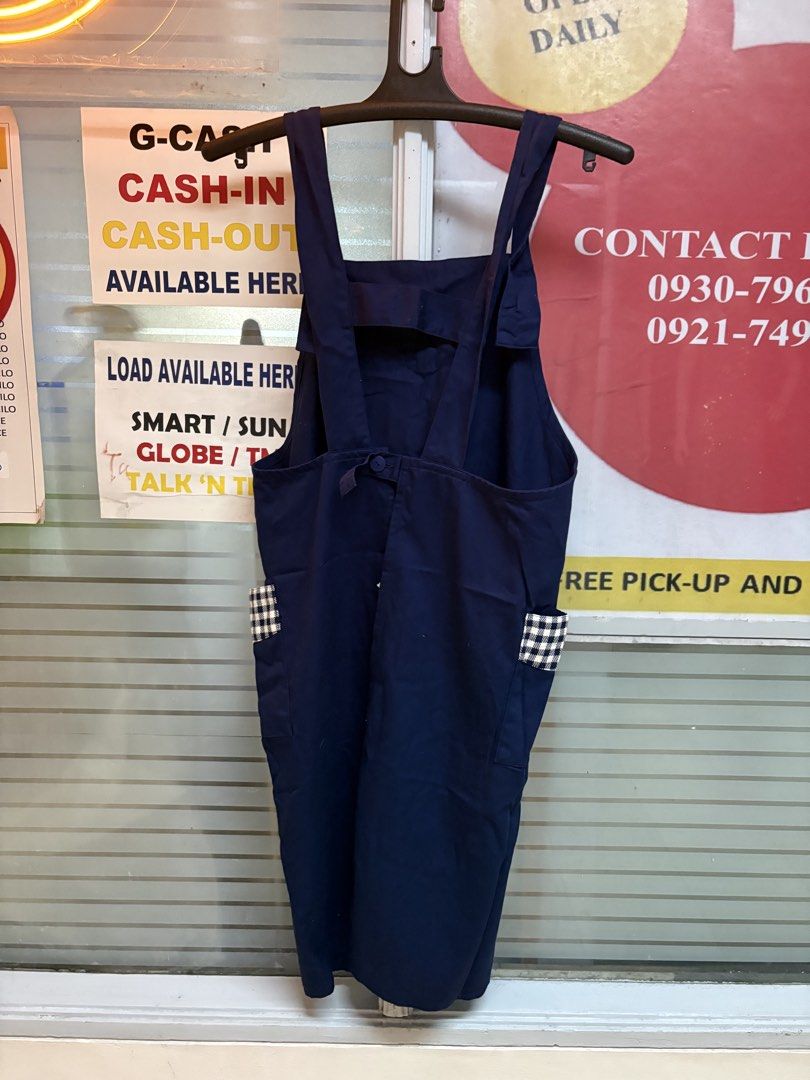 Navy Blue Pinafore Apron with Gingham Pockets (Category: Dresses) located in Makati City. Submitted by neelojosue75925 (Listing ID 1457454190, Image 1). Description: - Cute navy blue pinafore apron - Gingham trim on chest and side pockets - Adjustable straps - Tie at the back - Ideal for cooking, crafting, or gardening - Easy to wear and wash - Perfect for everyday use.