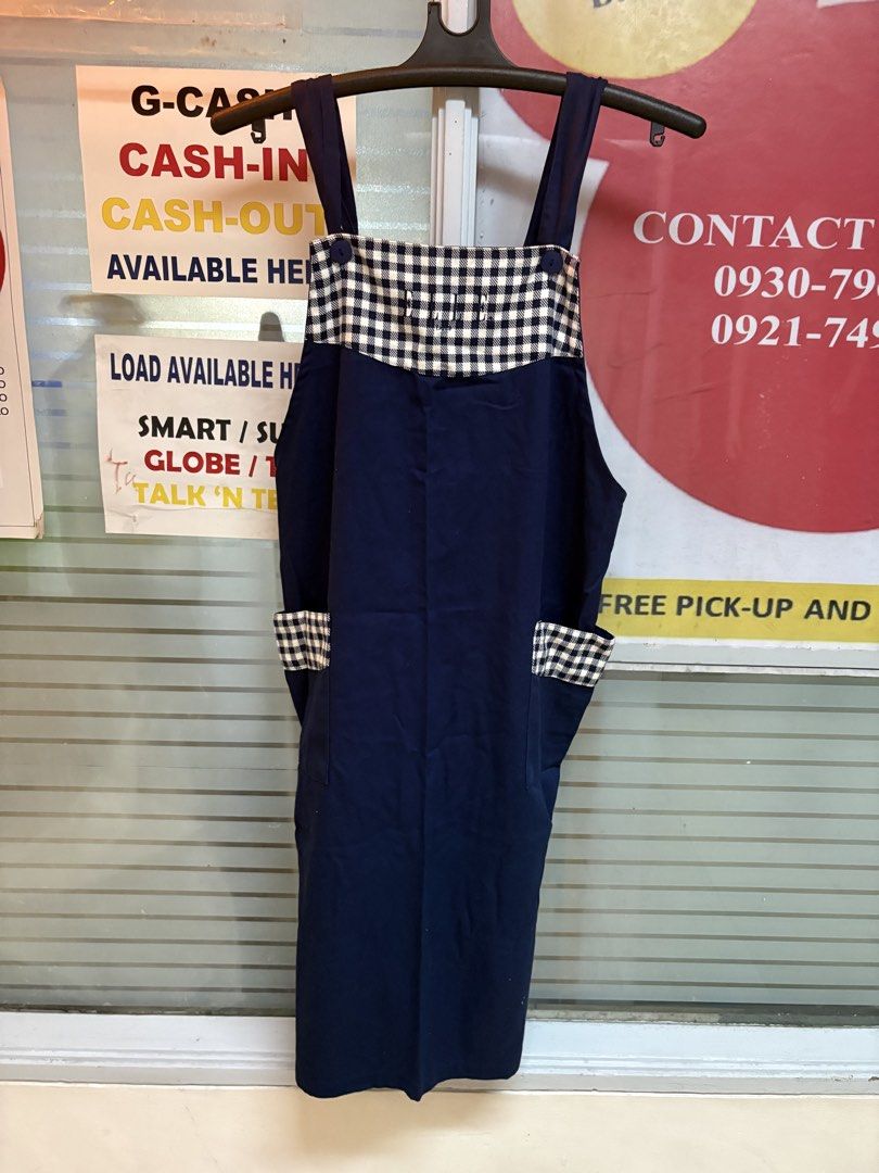 Navy Blue Pinafore Apron with Gingham Pockets (Category: Dresses) located in Makati City. Submitted by neelojosue75925 (Listing ID 1457454190, Image 2). Description: - Cute navy blue pinafore apron - Gingham trim on chest and side pockets - Adjustable straps - Tie at the back - Ideal for cooking, crafting, or gardening - Easy to wear and wash - Perfect for everyday use.