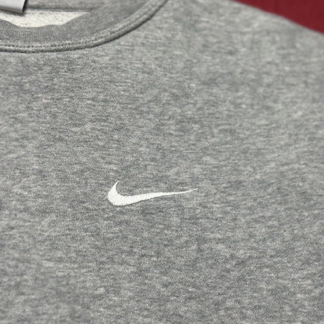 Nike Grey Crewneck Sweatshirt Size L (Category: Coats, Jackets and Outerwear) located in Daet. Submitted by thrifthings2018 (Listing ID 1457432066, Image 3). Description: Grey Nike crewneck sweatshirt. Size L. Made in Pakistan. Simple design with a small embroidered swoosh on the chest. Great for everyday wear. Measurements: width 25 inches, length 27 inches..