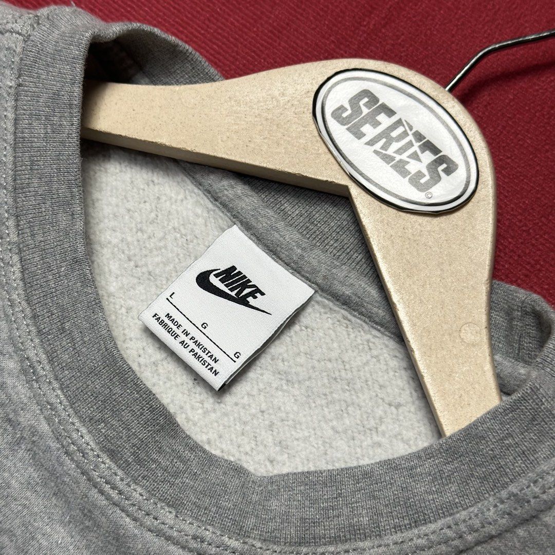 Nike Grey Crewneck Sweatshirt Size L (Category: Coats, Jackets and Outerwear) located in Daet. Submitted by thrifthings2018 (Listing ID 1457432066, Image 2). Description: Grey Nike crewneck sweatshirt. Size L. Made in Pakistan. Simple design with a small embroidered swoosh on the chest. Great for everyday wear. Measurements: width 25 inches, length 27 inches..