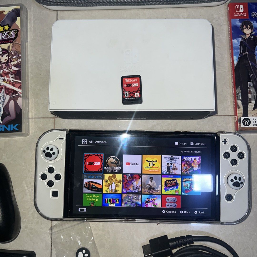 Nintendo Switch OLED White Console with Games & Accessories (Category: Nintendo) located in Caloocan City. Submitted by vanirrafinds (Listing ID 1457489223, Image 2). Description: As is. Pass sa reseller na barat. No issue. Nandiyan na lahat sa pic. Matagal ma lowbat. Unli check sa meet up. Meet up SMFAIRVIEW.