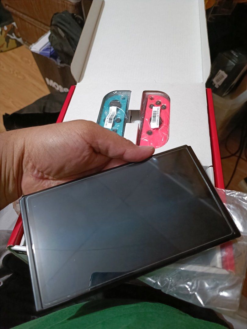 Nintendo Switch Oled with Games (Category: Nintendo) located in Quezon City. Submitted by boara17 (Listing ID 1457452933, Image 2). Description: For sale Nintendo Switch Oled Complete with accessories and box With cystal case With skull and co carry case With tempered glass installed With games Detective pickachu cart only Shin megami tensei V No drifting No issue 100% smooth 100% working 12500php Fixed price Pickup North fairview .