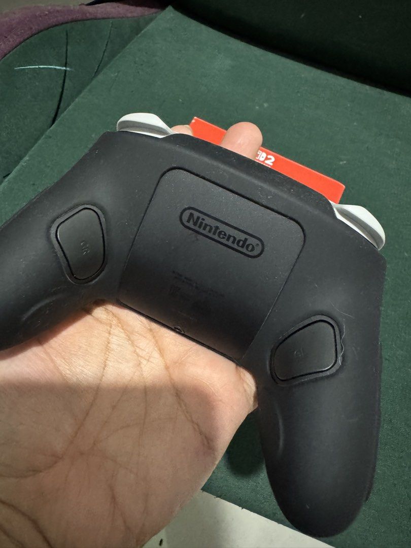 Nintendo Switch Pro Controller with Green Grips (Category: Controllers) located in San Manuel. Submitted by destram (Listing ID 1457455946, Image 3). Description: - Nintendo Switch Pro Controller - Includes original box - Comes with black silicone grip (green accents) - Works great for Switch gaming.
