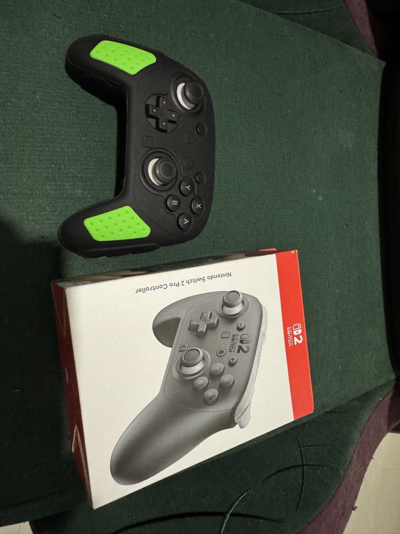 Nintendo Switch Pro Controller with Green Grips (Category: Controllers) located in San Manuel. Submitted by destram (Listing ID 1457455946, Image 1). Description: - Nintendo Switch Pro Controller - Includes original box - Comes with black silicone grip (green accents) - Works great for Switch gaming.