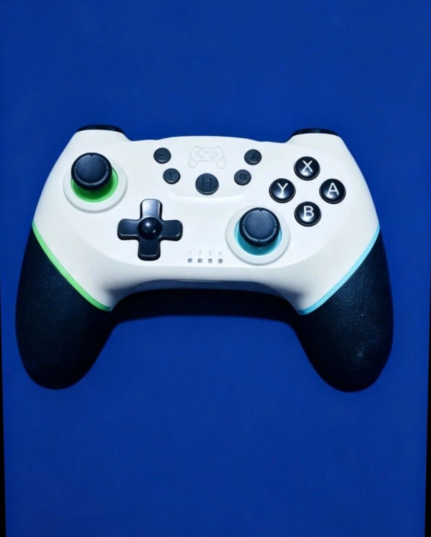 N-SL Wireless Controller White (Category: Controllers) located in Manila. Submitted by tangerine08 (Listing ID 1457449202, Image 1). Description: - White wireless controller for Nintendo Switch (N-SL) - Features a sleek black grip - Buttons have stylish black and green/blue accents - Fully tested and in excellent working condition - Ready for your next gaming session!.