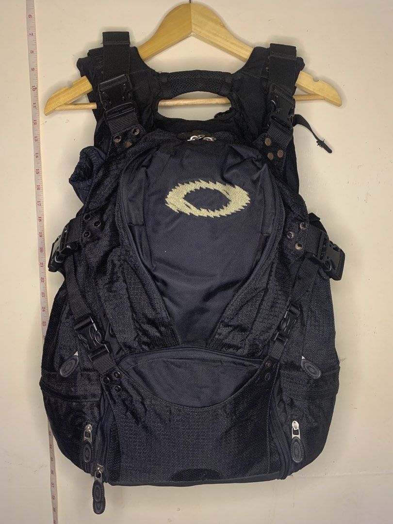 Oakley Black Tactical Backpack (Category: Backpacks) located in Aloran. Submitted by chester78864 (Listing ID 1457459541, Image 1). Description: - Black Oakley backpack - Multiple compartments and pockets for ample storage - Adjustable straps for a comfortable, customized fit - Made with durable material for long-lasting use - Ideal for everyday carry or outdoor activities - Prominent Oakley logo on the front.