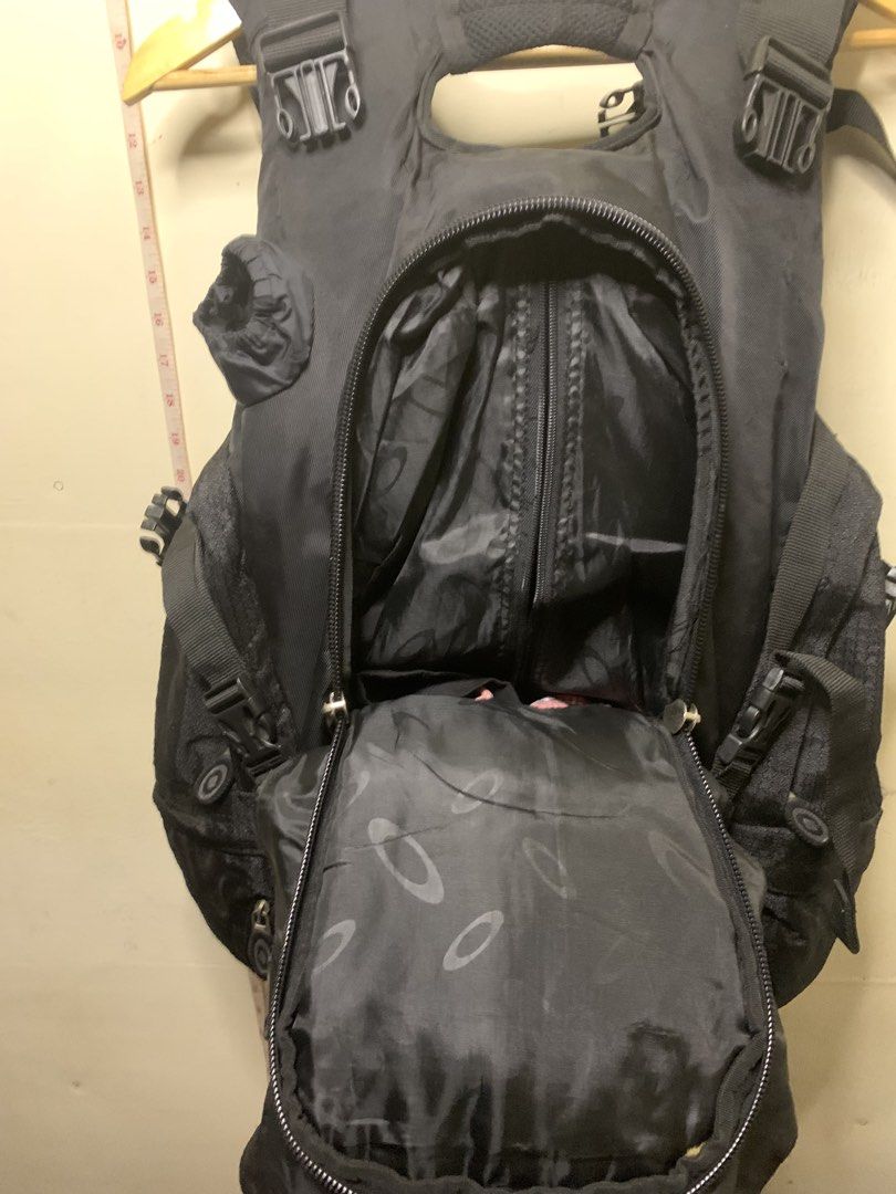 Oakley Black Tactical Backpack (Category: Backpacks) located in Aloran. Submitted by chester78864 (Listing ID 1457459541, Image 3). Description: - Black Oakley backpack - Multiple compartments and pockets for ample storage - Adjustable straps for a comfortable, customized fit - Made with durable material for long-lasting use - Ideal for everyday carry or outdoor activities - Prominent Oakley logo on the front.