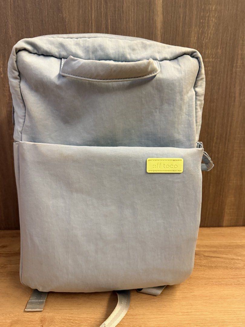 Offtoco backpack (Category: Backpacks) located in Singapore. Submitted by jellyfish1008 (Listing ID 1457459113, Image 1). Description: - Colour: Light blue - Interior Colour: Bright Lime Green - Features: Multiple internal pockets, zipped compartment, durable material - Style: Practical and stylish backpack.