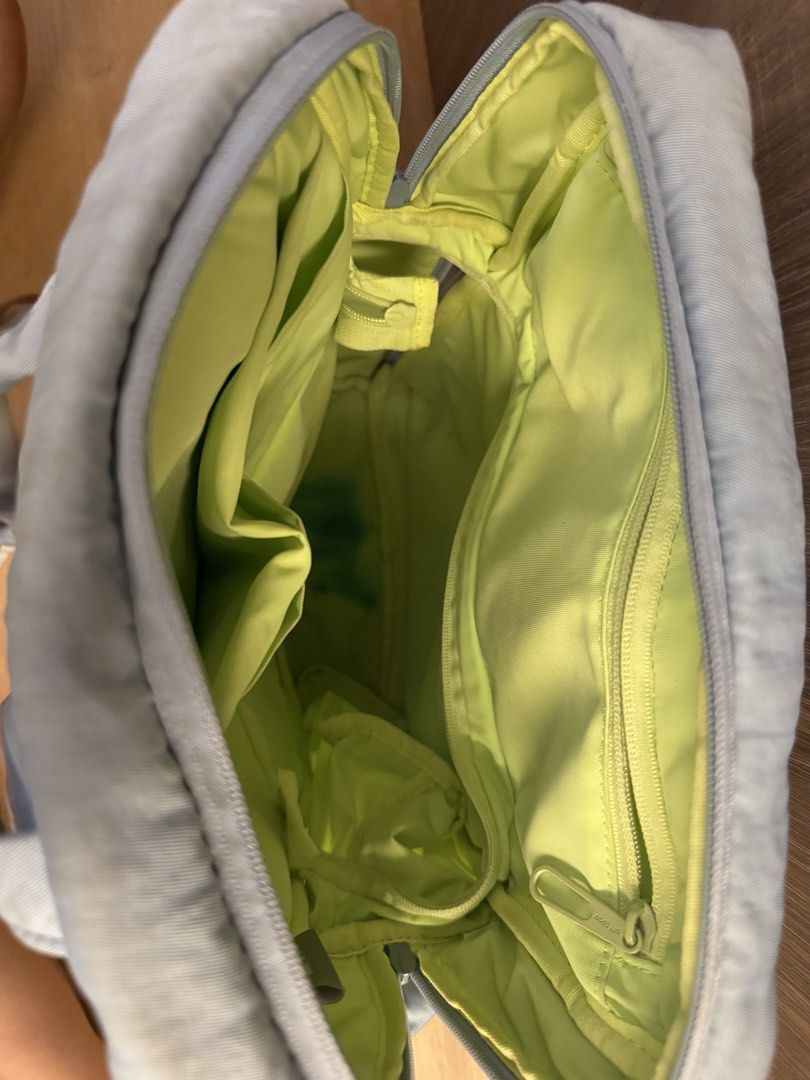 Offtoco backpack (Category: Backpacks) located in Singapore. Submitted by jellyfish1008 (Listing ID 1457459113, Image 3). Description: - Colour: Light blue - Interior Colour: Bright Lime Green - Features: Multiple internal pockets, zipped compartment, durable material - Style: Practical and stylish backpack.