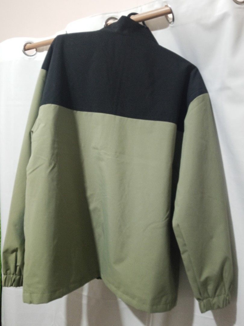 Olive Green & Black Color Blocked Windbreaker Jacket (Category: Coats, Jackets and Outerwear) located in Bulacan. Submitted by danielstorm (Listing ID 1457510695, Image 2). Description: Olive Green & Black Color Blocked Windbreaker Jacket Selling as-is Size Large On Tag Condition: As-is Price: 120php Loc. Sta Maria Bulacan Courier. Lalamove ONLY (Buyer books and pays shipping fee) Payment: Cash, GCash, or Maya.