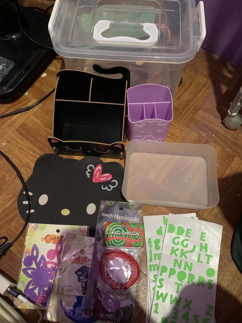 Organizer Set take all (Category: Craft Supplies & Tools) located in Manila. Submitted by usagichan_rabbit (Listing ID 1457393614, Image 1). Description: - Bundle of craft supplies perfect for organizing your space. - Includes a black cat desk organizer. - Features a purple Eiffel Tower pen holder. - Comes with a Kitty mousepad. - Alphabet stickers included. - Various craft embellishments: flower cutouts and red ribbon. - Also includes a clear st