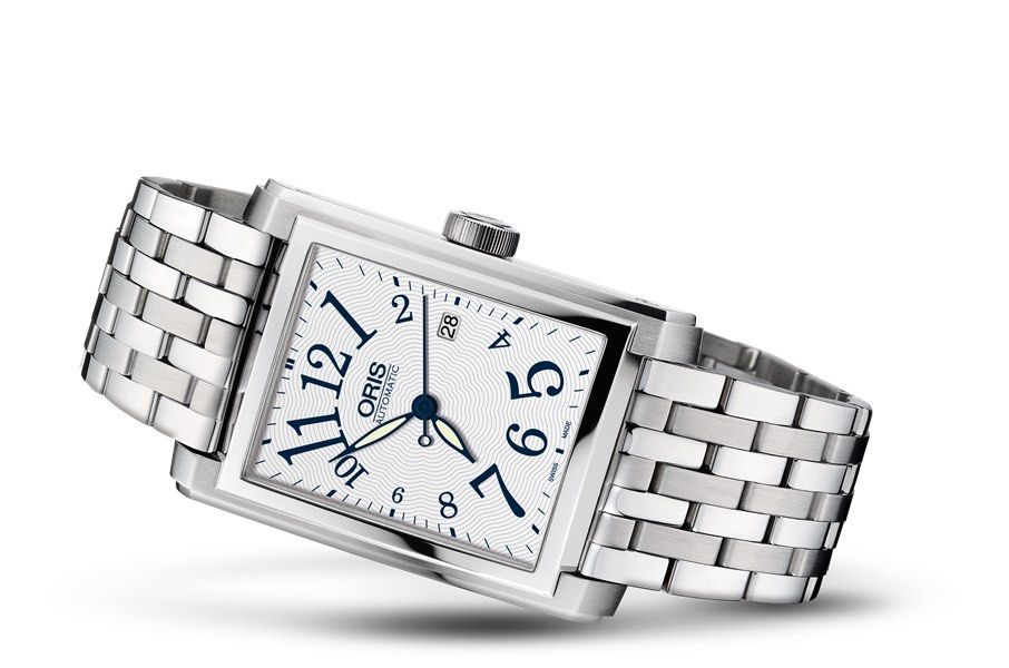 Oris 7656 Rectangular date Automatic White Dial (Category: Watches) located in Singapore. Submitted by themacvision (Listing ID 1457405579, Image 1). Description: Near mint condition Oris Rectangular Date, reference 7656. * Automatic mechanical movement * White dial with Arabic numerals * Date display * Original stainless steel bracelet * Fits wrist up to approximately 17.5cm * 25 jewels * Classic rectangular design * Watch only * No papers or se