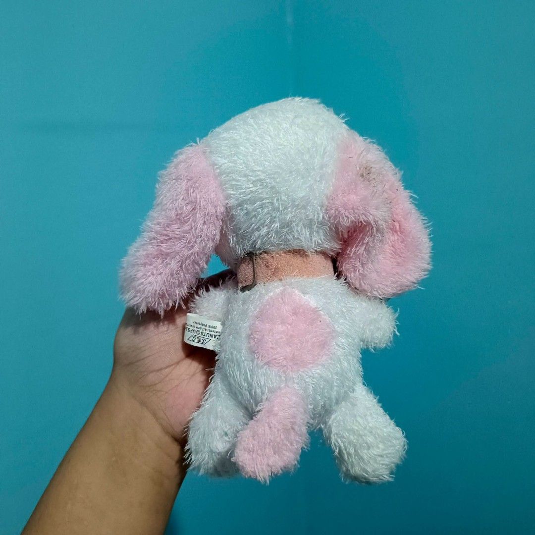 Pink Snoopy Peanuts plusj (Category: Plushies & Soft Toys) located in Baguio. Submitted by baileybails (Listing ID 1457464532, Image 2). Description: - Adorable white and pink dog plush toy - Features cute pink ears and spots - Made from 100% polyester - Brand: Peanuts UFS, Inc. SRG - Perfect for dog lovers, collectors, or as a thoughtful gift - Approximately 6 inches in height.