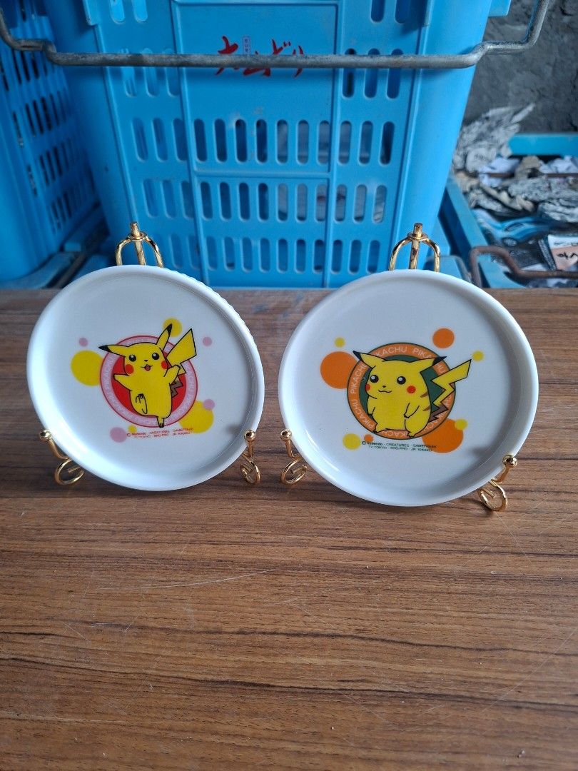 Pokemon Pikachu small plates (Category: Dinnerware & Cutlery) located in Consolacion. Submitted by luxekerei (Listing ID 1457393696, Image 2). Description: - diameter 11cm - vintage 1990s Pokémon mini ceramic plates feature early-design Pikachu graphics with copyright markings from Nintendo, Creatures, and Game Freak.