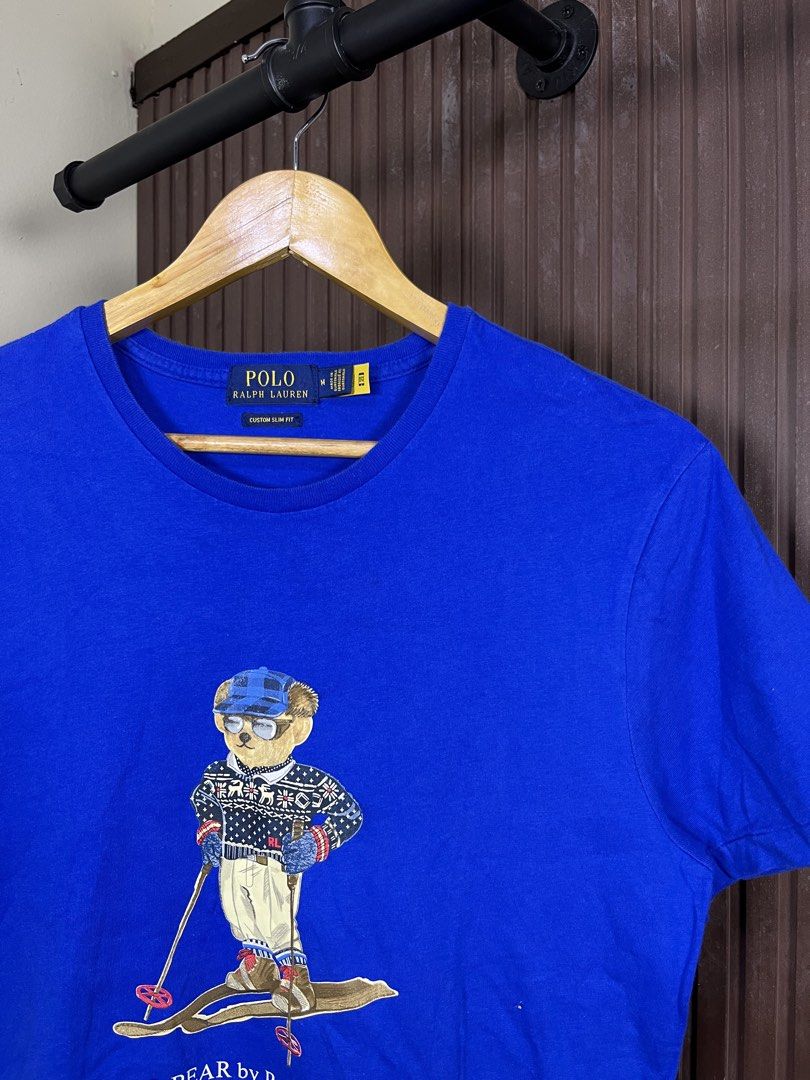 Polo Ralph Lauren Ski Bear Tee (Category: Tshirts & Polo Shirts ) located in Cabanatuan. Submitted by cabsygoods (Listing ID 1457347865, Image 2). Description: Polo Ralph Lauren Ski Bear Tee Dimes 19 x 27.5 inches Very good condition No issue Color rate 9/10 Dm to purchase! 📩.