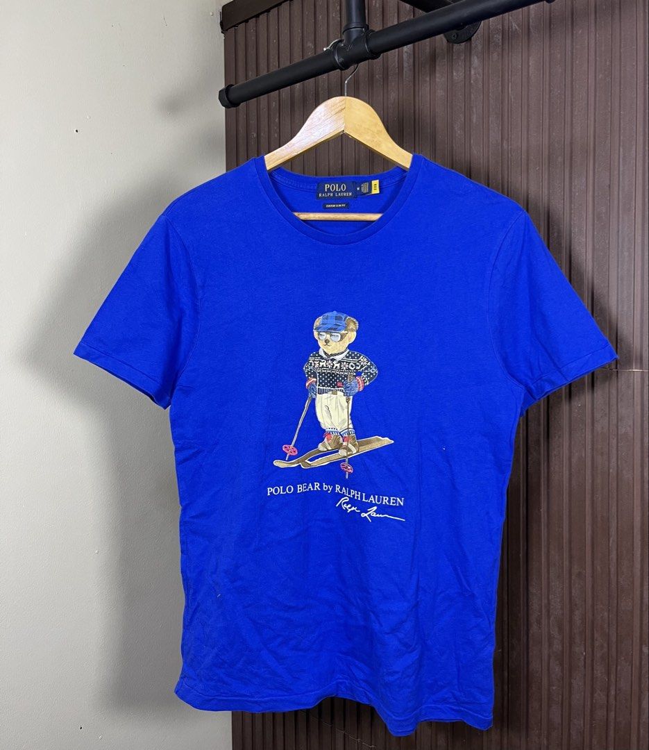 Polo Ralph Lauren Ski Bear Tee (Category: Tshirts & Polo Shirts ) located in Cabanatuan. Submitted by cabsygoods (Listing ID 1457347865, Image 1). Description: Polo Ralph Lauren Ski Bear Tee Dimes 19 x 27.5 inches Very good condition No issue Color rate 9/10 Dm to purchase! 📩.