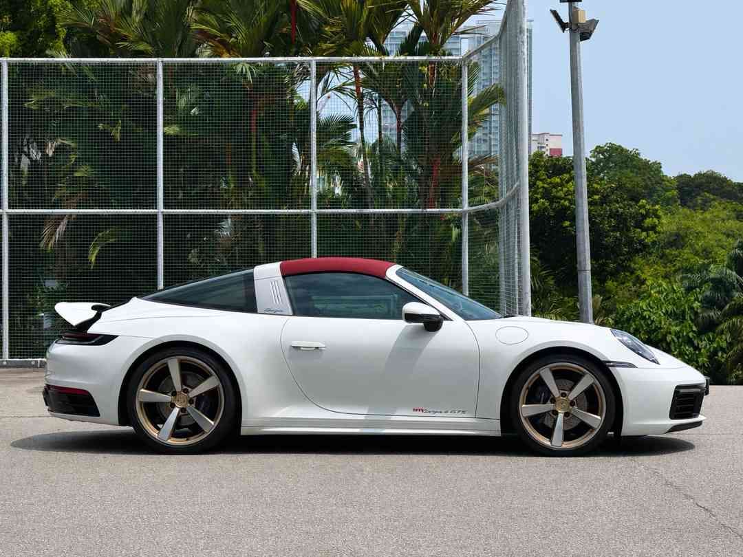 Porsche 911 Targa 4 PDK 3.0 (A) (Category: Used Cars) located in Singapore. Submitted by signaturemotors (Listing ID 1457390841, Image 3). Description: Showroom: 237 ALEXANDRA ROAD 237 Alexandra Road #02-04 Singapore 159929 5-Years Warranty/Maintenance Programme With Agent From Reg Date. White Body With Red Soft Top And Black Leather Interior. Sport Chrono Package In White Dial. PASM. Sport Exhaust System With Black Tips. 20/21" Carrera Exclusive
