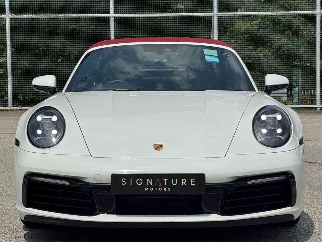 Porsche 911 Targa 4 PDK 3.0 (A) (Category: Used Cars) located in Singapore. Submitted by signaturemotors (Listing ID 1457390841, Image 1). Description: Showroom: 237 ALEXANDRA ROAD 237 Alexandra Road #02-04 Singapore 159929 5-Years Warranty/Maintenance Programme With Agent From Reg Date. White Body With Red Soft Top And Black Leather Interior. Sport Chrono Package In White Dial. PASM. Sport Exhaust System With Black Tips. 20/21" Carrera Exclusive
