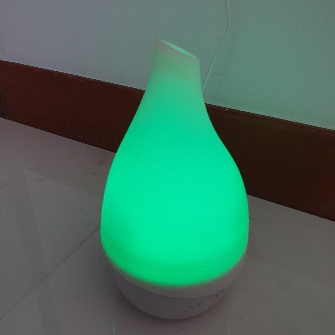 Portable Aroma Diffuser (Category: Home Fragrance) located in Singapore. Submitted by goodsbykrystal (Listing ID 1457391421, Image 3). Description: Diameter 11cm x Height 21 cm In good working condition Color charging mode Simple 2 buttons setting Slight oil stained Not for the picky Pick up at Hillsta Condo Tower B S668201 WA Krystal 9.0.6.2.5.0.1.6 for Payment & Pickup Thank you!.