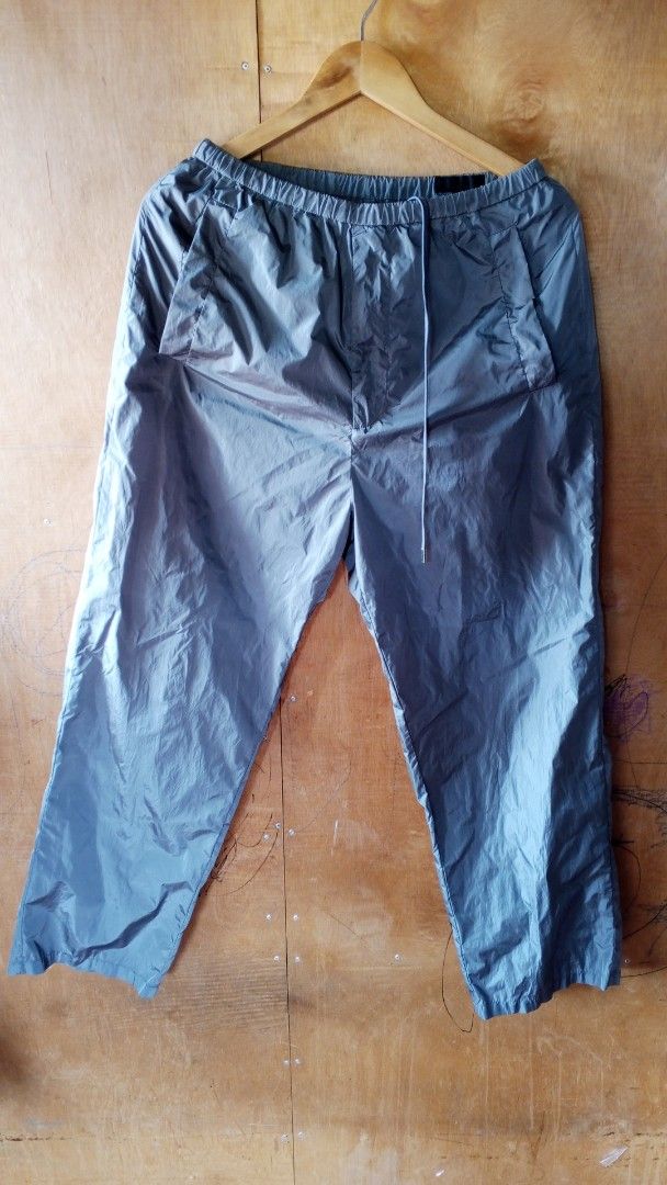 Prada Nylon Track Pants Size M Grey (Category: Joggers) located in Manila. Submitted by wildowl-3a19 (Listing ID 1457483812, Image 2). Description: - Grey Prada Nylon Pants - Size: M - Elastic waistband with drawstring - Two side pockets - One back pocket - Features iconic Prada triangle logo on back pocket - Made in Italy.