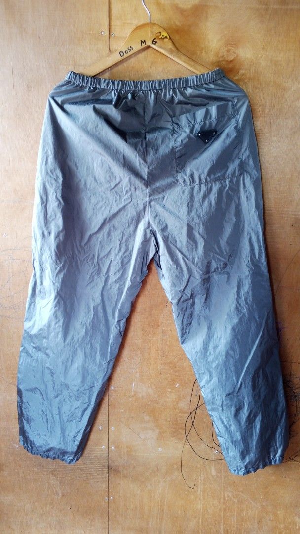 Prada Nylon Track Pants Size M Grey (Category: Joggers) located in Manila. Submitted by wildowl-3a19 (Listing ID 1457483812, Image 1). Description: - Grey Prada Nylon Pants - Size: M - Elastic waistband with drawstring - Two side pockets - One back pocket - Features iconic Prada triangle logo on back pocket - Made in Italy.