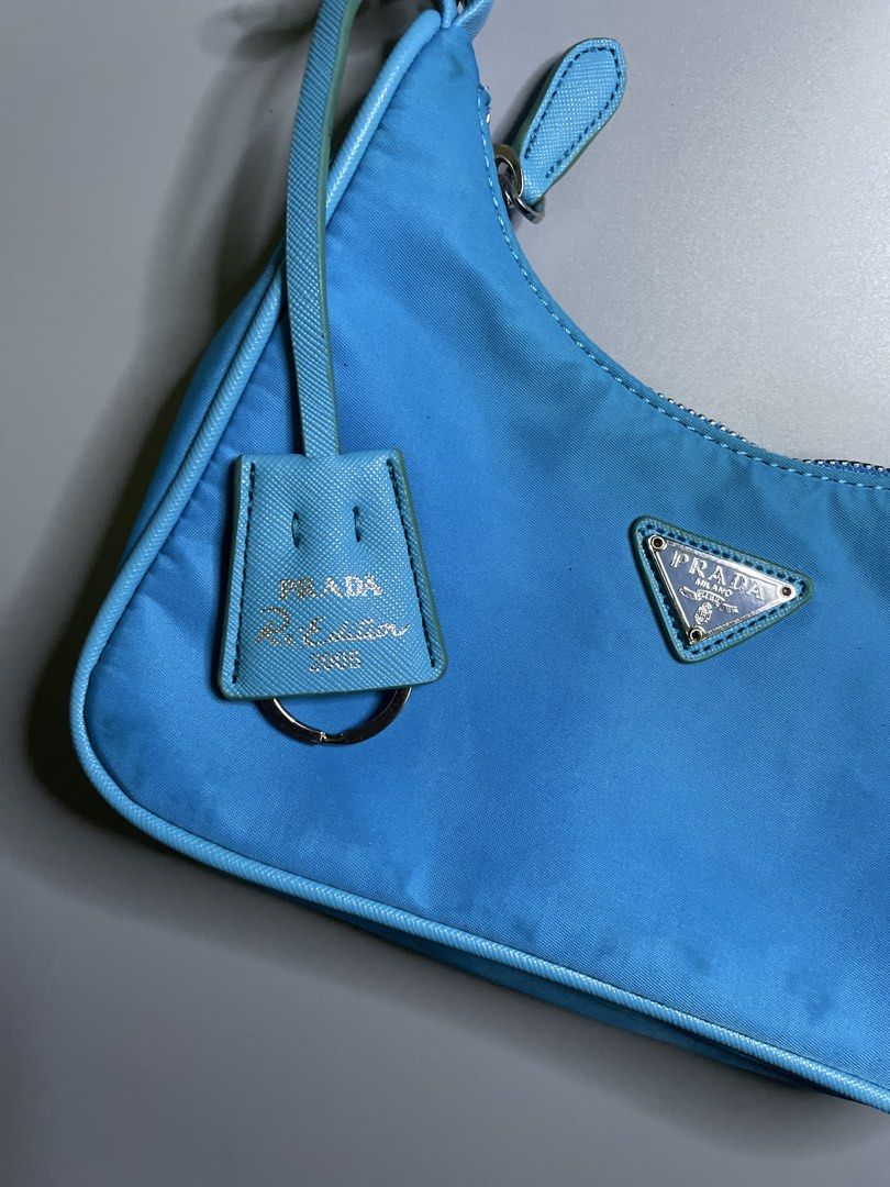 Prada Re-Edition 2005 Small Shoulder Bag (Category: Luxury Bags & Wallets) located in Bocaue. Submitted by mosthighcollective (Listing ID 1457369514, Image 2). Description: Prada Re-Edition 2005 Small Shoulder Bag Prada Re-Edition 2005 Nylon Mini Bag in bright blue features a signature enameled metal triangle logo. Good as new Condition No issue/ No flaws 5000 only Dm me to purchase 📥 .