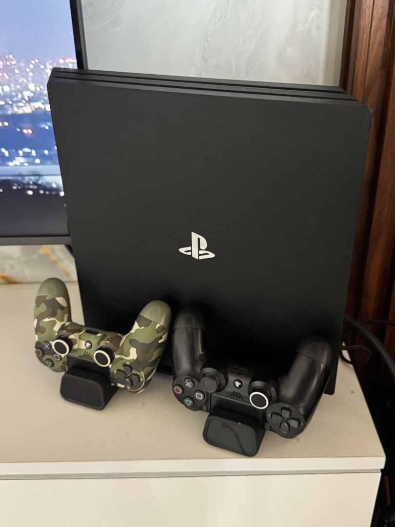 PS4 Pro 1TB complete package (Category: PlayStation) located in Bulacan. Submitted by gemini_7 (Listing ID 1457339145, Image 2). Description: Inclusions: -PS4 Pro (original box not included will be carefully packed for shipping) -2 original ds4 controllers -charging dock + console stand + CD organizers -power cable -HDMI cable -USB cable for controller Games -tekken7 -2k25 -The Last of Us Remastered -UFC PS4 Pro is well taken care of. Ready to us