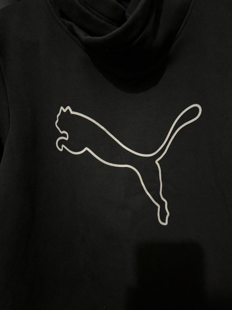 Puma Black Sweatshirt with Large Cat Logo (Category: Coats, Jackets and Outerwear) located in Iligan City. Submitted by kitkatdeclutters (Listing ID 1457447828, Image 3). Description: - Black Puma sweatshirt - Iconic white outline Puma cat logo on front - Smaller Puma logo on left sleeve cuff - High neckline for extra warmth - Comfortable and stylish - Ideal for casual wear or workouts.
