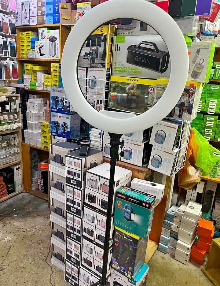 Ring Light with Tripod and Phone Holder (Category: Lighting & Studio Equipment) located in Manila. Submitted by hasylne.818 (Listing ID 1457467516, Image 3). Description: - Ring light with tripod stand and phone holder - Ideal for selfies, vlogging, and makeup application - Adjustable height and angle for perfect positioning - Provides bright and even lighting - Comes with original box and all accessories - Simple and easy to set up and use 26cm 