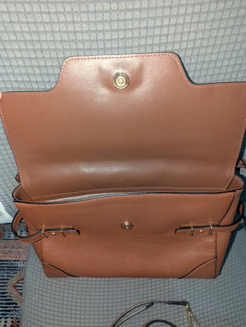 Samantha Thavasa Brown Leather Top Handle Bag (Category: Luxury Bags & Wallets) located in Pasig City. Submitted by gigigigi3366 (Listing ID 1457334212, Image 2). Description: - Brand: Samantha Thavasa - Material: Brown Genuine Leather - Features: Top handle, detachable shoulder strap - Interior: Branded fabric lining - Exterior: Buckle details on the front, gold hardware - Condition: Clean inside and out - Style: Great everyday bag no flaws, loo