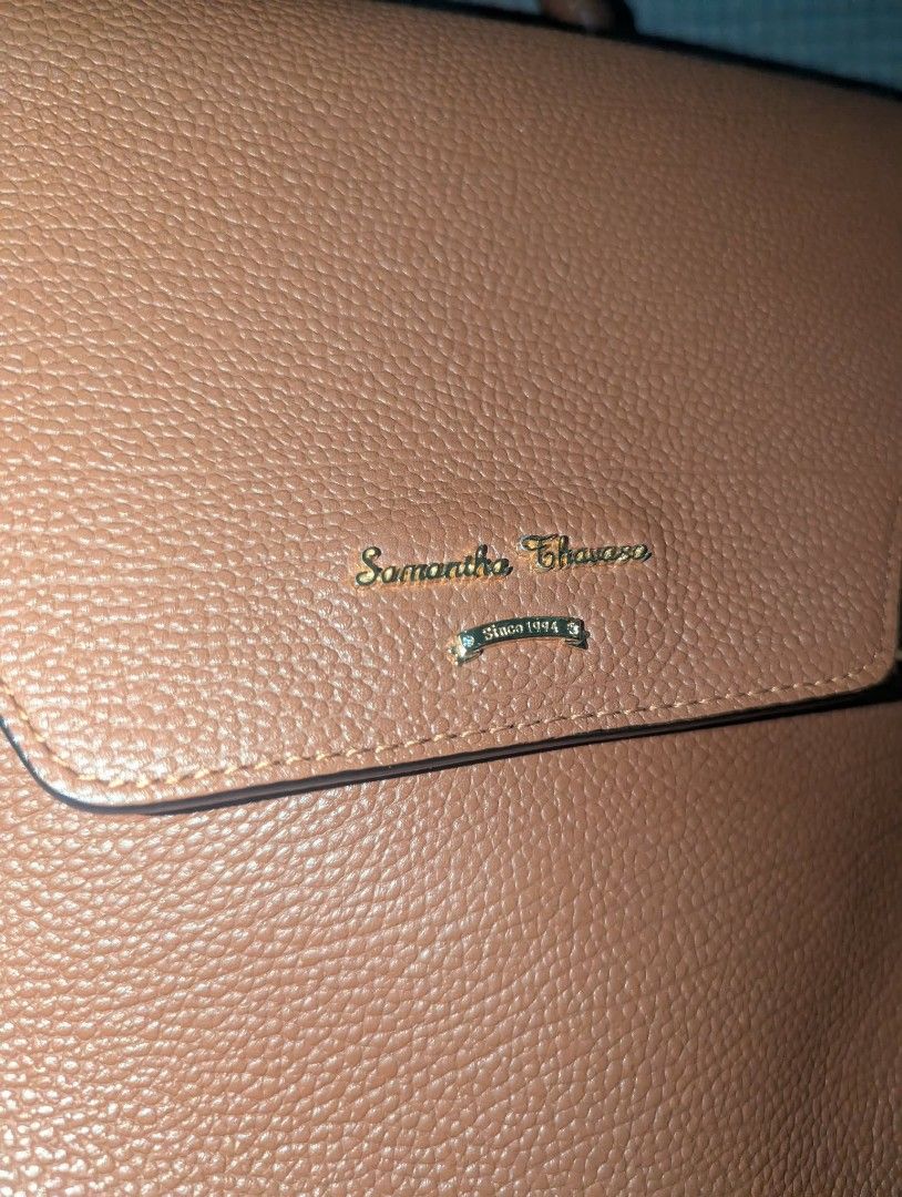 Samantha Thavasa Brown Leather Top Handle Bag (Category: Luxury Bags & Wallets) located in Pasig City. Submitted by gigigigi3366 (Listing ID 1457334212, Image 3). Description: - Brand: Samantha Thavasa - Material: Brown Genuine Leather - Features: Top handle, detachable shoulder strap - Interior: Branded fabric lining - Exterior: Buckle details on the front, gold hardware - Condition: Clean inside and out - Style: Great everyday bag no flaws, loo