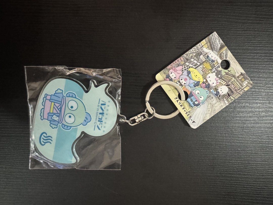 Sanrio Hangyodon Duck Keychain (Category: Character Goods) located in Trece Martires City. Submitted by lakingking (Listing ID 1457372795, Image 2). Description: - Adorable Hangyodon keychain from Sanrio. - Features the character as a cute duck with blue and white stripes. - Comes with a durable metal keyring. - Ideal accessory for bags, backpacks, or keys. - Backing card displays other popular Sanrio characters..