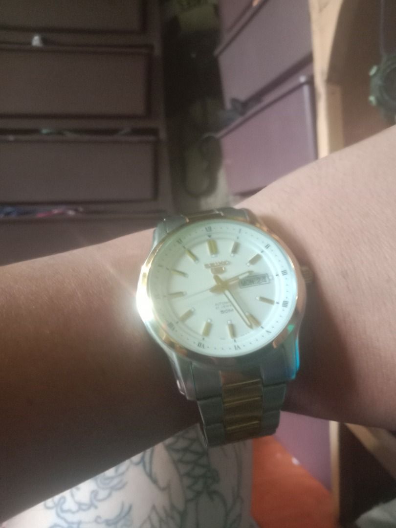 Seiko 5 Original (Category: Luxury Watches) located in Caloocan City. Submitted by carlylle08 (Listing ID 1457384861, Image 1). Description: `Seiko 5 Automatic Two-Tone 21Jewels 50M Day-Date SNKL` O kung di sure sa model: `Seiko 5 Automatic Two-Tone White Dial 7S26 Movement` - *Brand/Model*: Seiko 5 Automatic - *Movement*: Seiko 7S26 Automatic, 21 Jewels - *Features*: Day-Date, 50M Water Resistant, Stainless Steel Two-Tone Bracelet - *Dial*: Whit