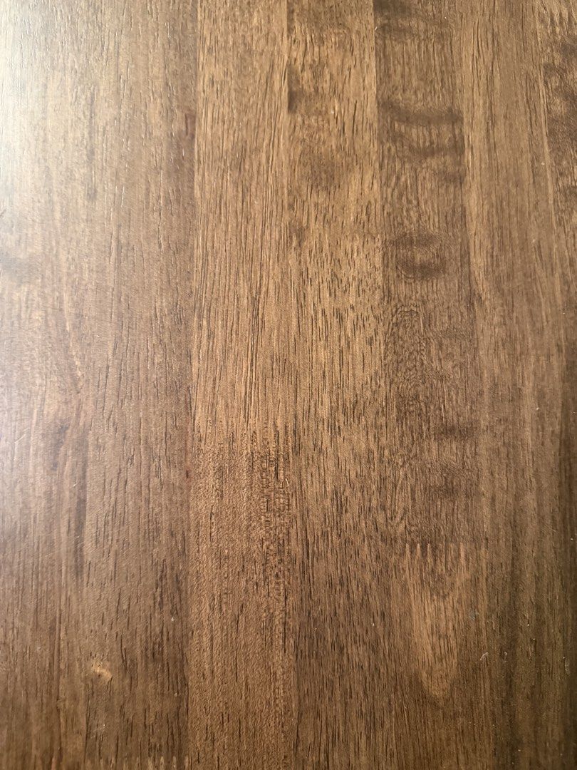 Solid Wood Dining Table (Category: Tables & Sets) located in Singapore. Submitted by makeshift_shop (Listing ID 1457482582, Image 3). Description: Solid wood dining table with a natural wood grain finish. The table has a live edge detail on one side. Great for family meals or entertaining guests. Seats 8 plush chairs comfortably..