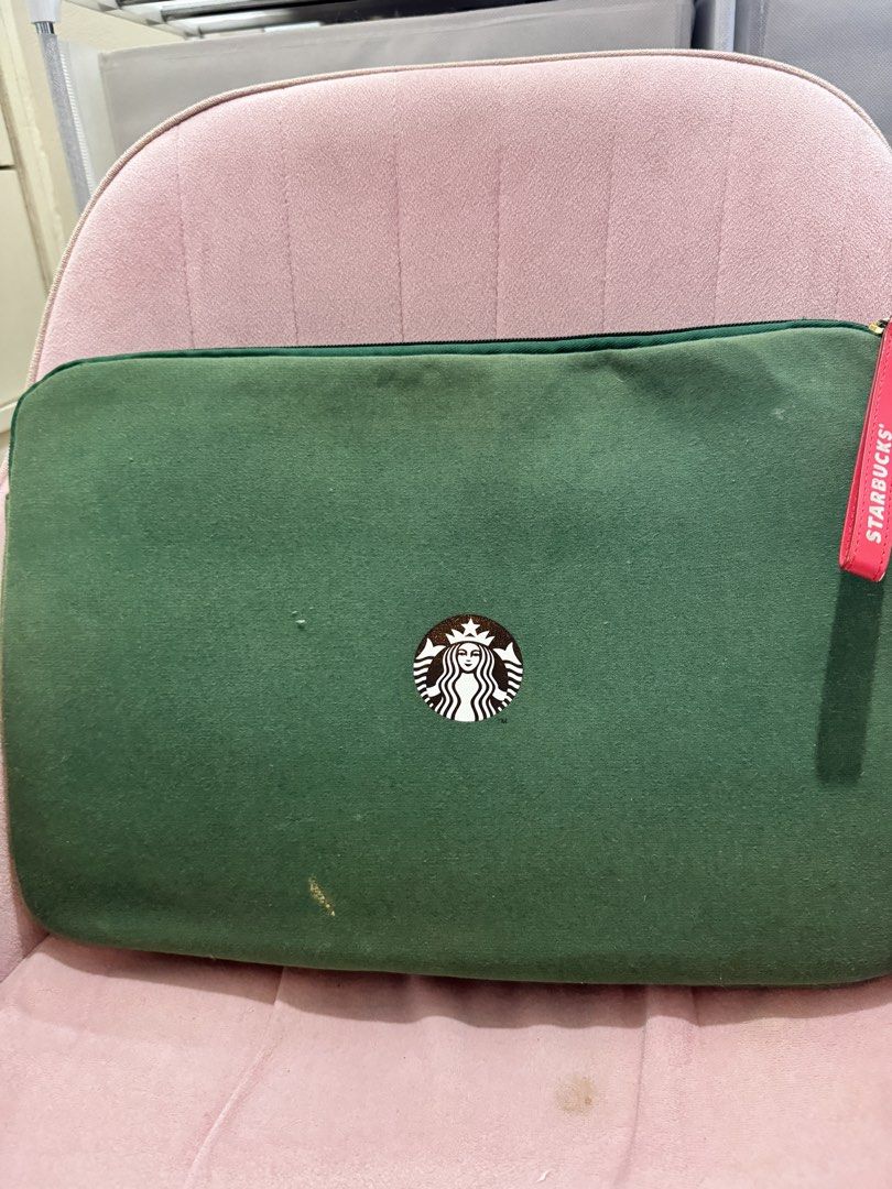 Starbucks Green Laptop Sleeve (Category: Laptop Bags & Sleeves) located in Dasmarinas. Submitted by queensu (Listing ID 1457401916, Image 2). Description: Green laptop sleeve from Starbucks. Features a cute polar bear with a Santa hat holding a cup. The inside is soft and padded. Great for storing your laptop or tablet. Has a red Starbucks tag on the zipper. Some minor marks on the front and back, as shown in photos. .