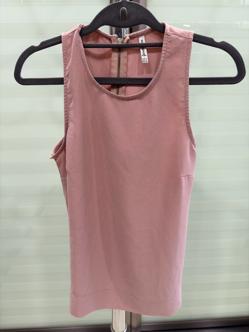 Stradivarius Pink Sleeveless Top Size S (Category: Sleeveless) located in Manila. Submitted by act92 (Listing ID 1457362095, Image 1). Description: - Brand: Stradivarius - Color: Pink - Style: Sleeveless top - Closure: Zip at the back - Size: Fits size S.