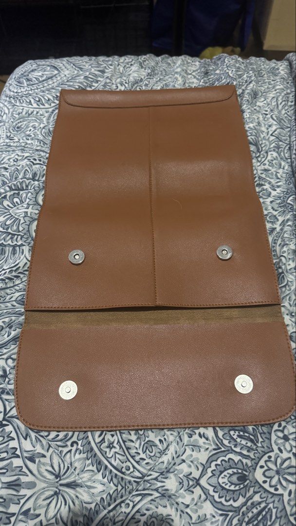 STRAIGHTFORWARD Brown Leather Laptop Sleeve Pouch (Category: Laptop Bags & Sleeves) located in Taguig. Submitted by flostrong (Listing ID 1457441916, Image 2). Description: - Genuine brown faux leather laptop sleeve from Straightforward - Magnetic snap closure for secure fastening - Fits laptops up to 13 inches - Slim and minimalist design - Provides excellent protection for your device on the go - Simple and highly functional RFS: not in use.